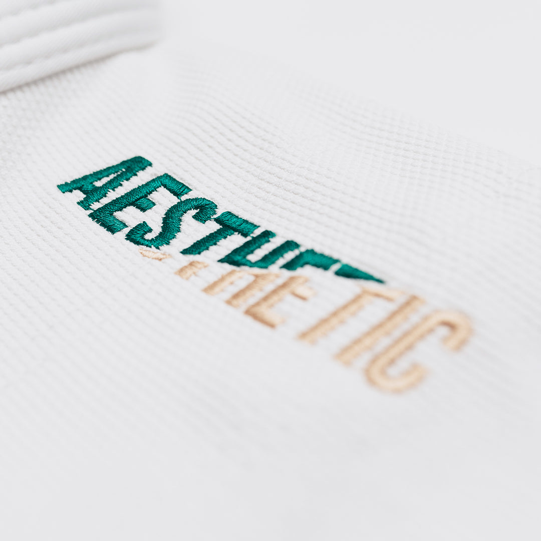 AESTHETIC The Competitor BJJ Gi Kimono - White/Pine Green close up logo