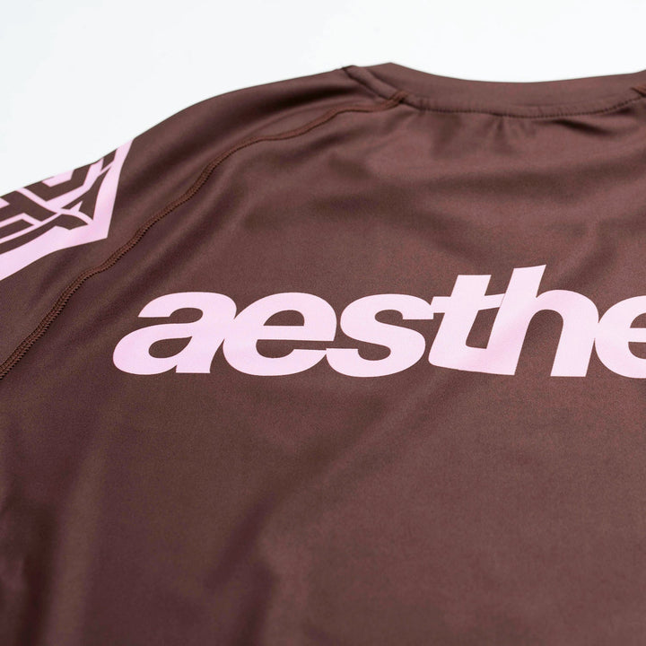 AESTHETIC Axis Short Sleeve Rashguard - Chestnut Brown top details