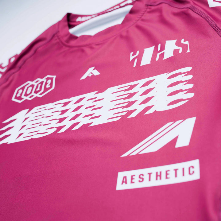 AESTHETIC Axis Short Sleeve Rashguard - Ruby Red front close up