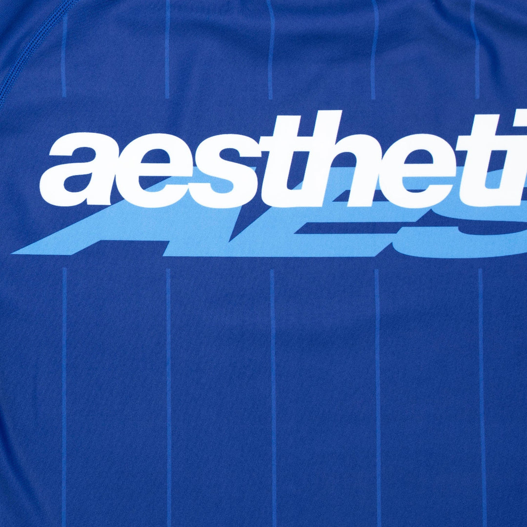 AESTHETIC UK Long Sleeve Ranked Rashguard 2026 Blue - logo close up