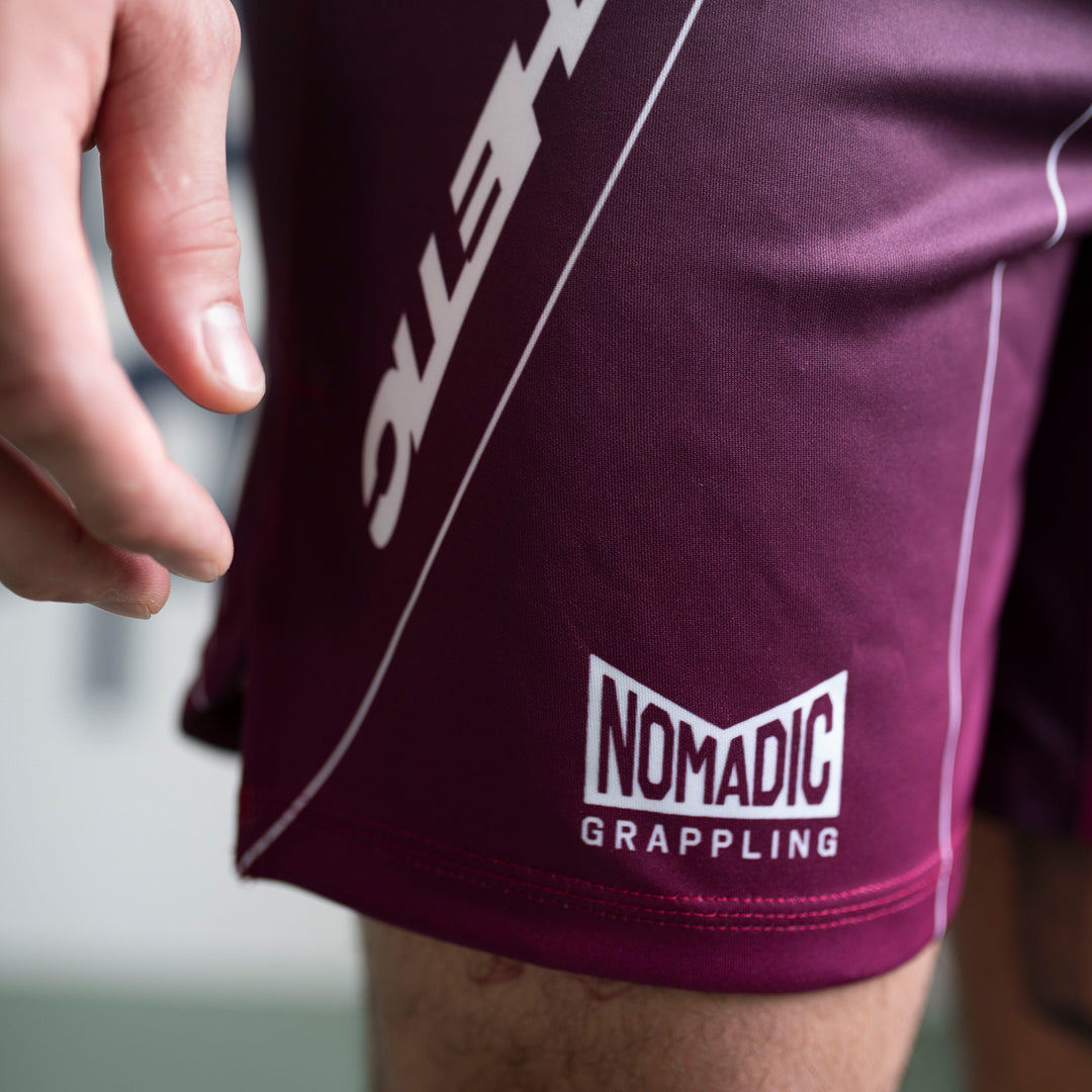 AESTHETIC Merlot ADCC 2026 Jozef Chen Combat Shorts - nomadic logo close up